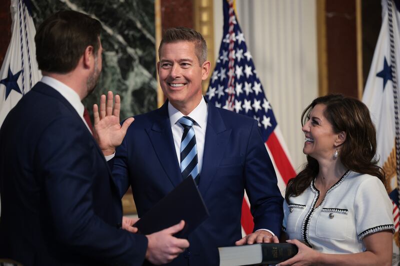 WASHINGTON, DC - JANUARY 29: Secretary of Transportation Sean Duffy is sworn-in by U.S. Vice President JD Vance (L) as Duffy's wife Rachel Campos-Duffy holds a Bible on January 29, 2025 in Washington, DC. Duffy, a former Congressman from Wisconsin, is the 20th U.S. Secretary of Transportation. He met his wife when they both appeared in an MTV reality show. (Photo by Win McNamee/Getty Images)