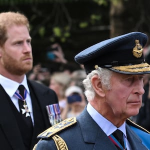 King Charles III and Prince Harry walk behind the coffin of Queen Elizabeth II during a procession from Buckingham Palace to the Palace of Westminster in London on September 14, 2022.