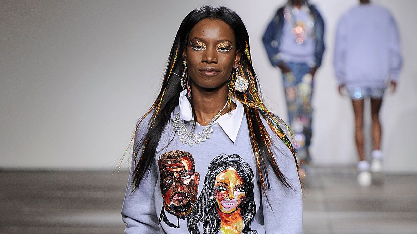 articles/2014/09/17/kimye-s-dazzling-terrifying-lfw-appearance/140917-jones-kimye-sweater-tease_iieslh