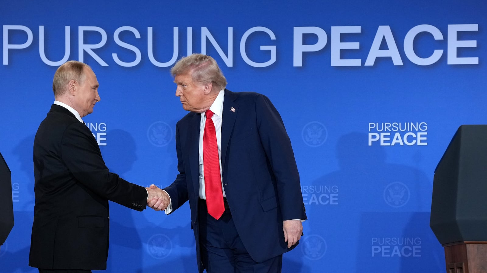 ANCHORAGE, ALASKA - AUGUST 15: U.S. President Donald Trump (R) and Russian President Vladimir Putin shake hands at the end of a press conference at Joint Base Elmendorf-Richardson on August 15, 2025 in Anchorage, Alaska. The two leaders are meeting for peace talks aimed at ending the war in Ukraine.