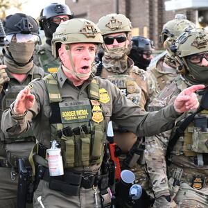 Border Patrol Chief Gregory Bovino of the El Centro Sector stands amid a protest outside an ICE facility
