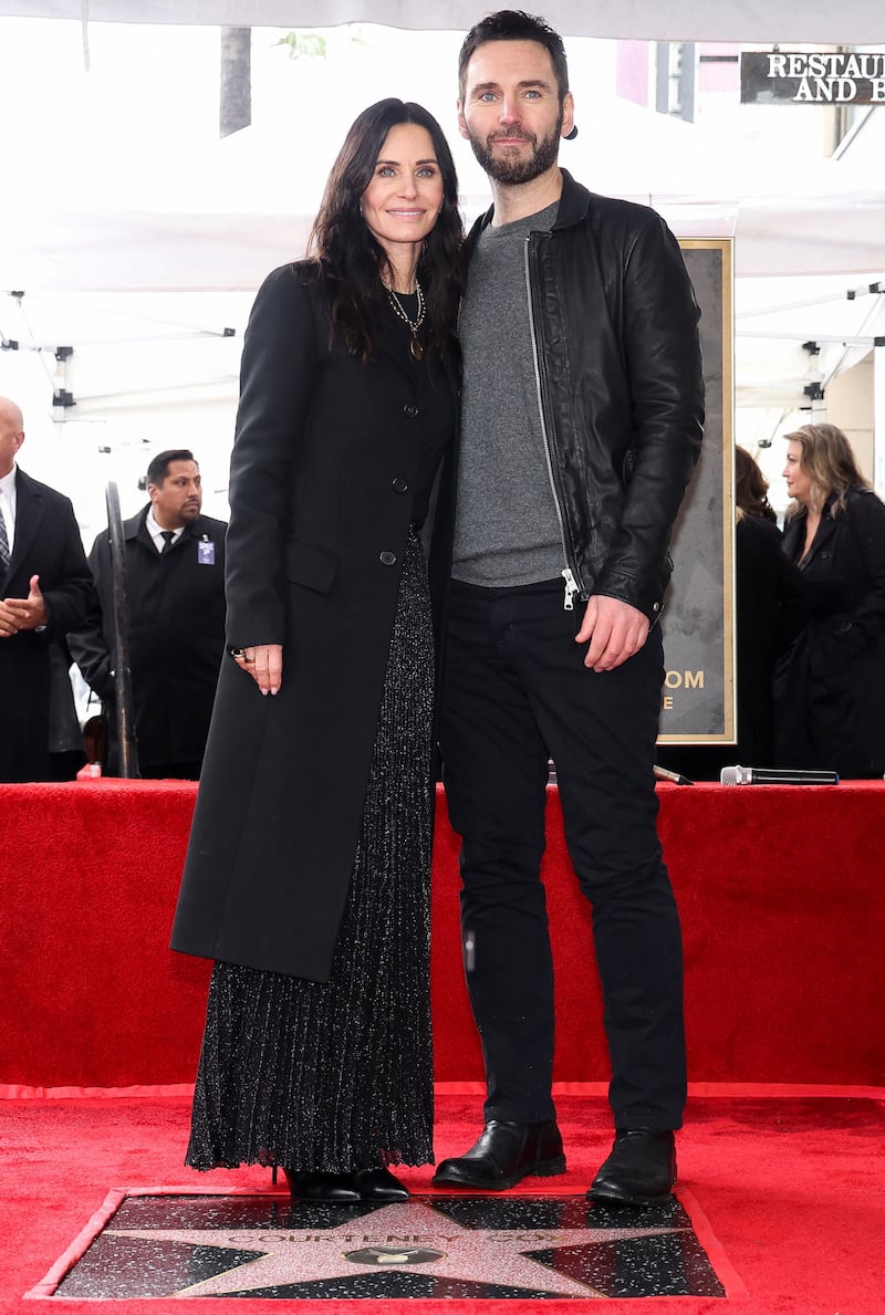 Actor Courteney Cox and her partner Johnny McDaid pose during Cox's star unveiling ceremony on the Hollywood Walk of Fame in Los Angeles, California, U.S., February 27, 2023.