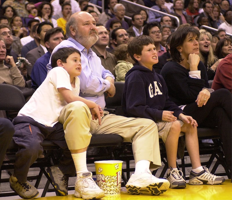 Director Rob Reiner and his family watch a game between the San Antonio Spurs and the Los Angeles Lakers