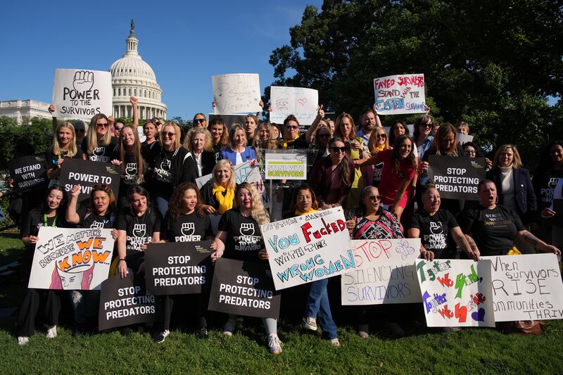 Survivors of Jeffrey Epstein and their supporters pose for a photo during a rally in support of victims of the disgraced financier and sex trafficker outside the U.S. Capitol on September 03, 2025 in Washington, DC.