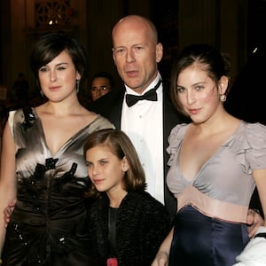 Actor Bruce Willis and his daughters (L-R) Rumer Glenn Willis,Tallulah Belle Willis and Scout LaRue Willis pose as they arrive for the "Ocean's Twelve" gala black tie premiere in Hollywood December 8, 2004. [The film directed by Steven Soderbergh and produced by Jerry Weintraub, about a group of high class thieves and their friends opens in theaters December 10.]