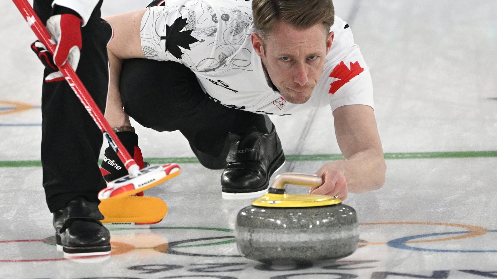 Canada's Marc Kennedy competes in the curling men's round robin between Switzerland and Canada during the Milano Cortina 2026 Winter Olympic Games at the Cortina Curling Olympic Stadium in Cortina d'Ampezzo on February 14, 2026. (Photo by Tiziana FABI / AFP via Getty Images)