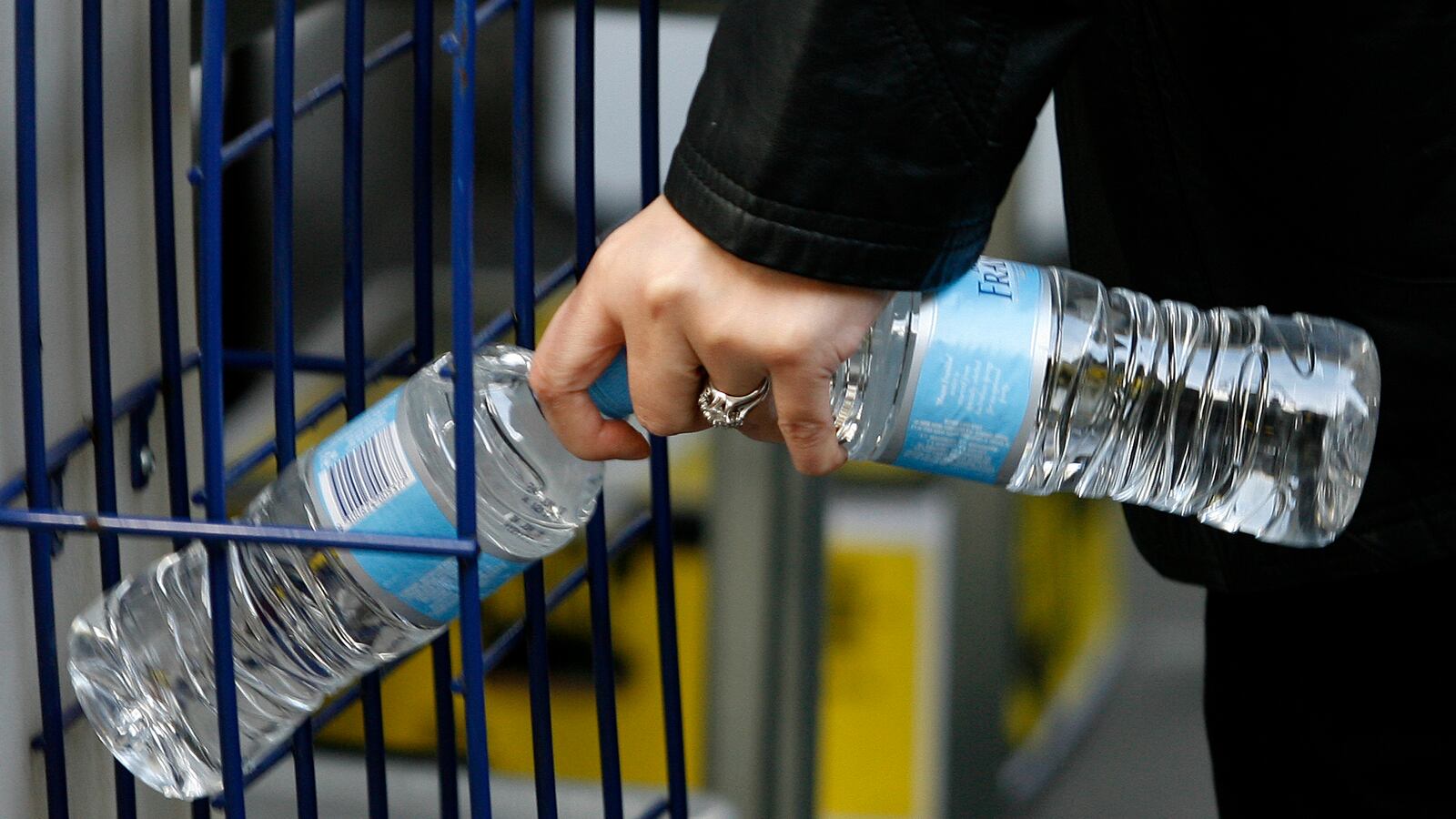 A woman picks up bottled water at a store in central Sydney.