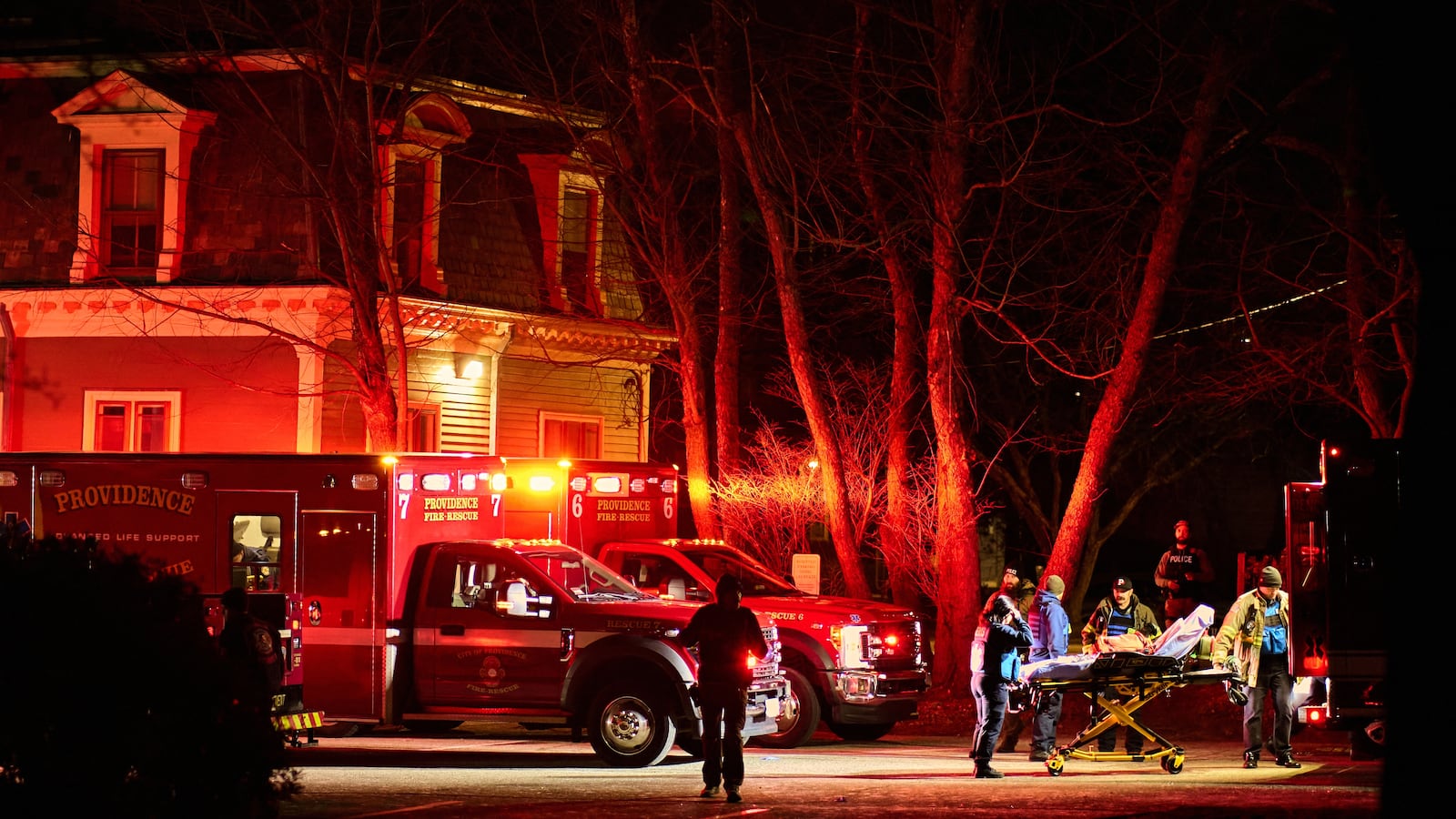 First responders with the Providence Fire Department maneuver an empty stretcher near the Barus & Holley building.