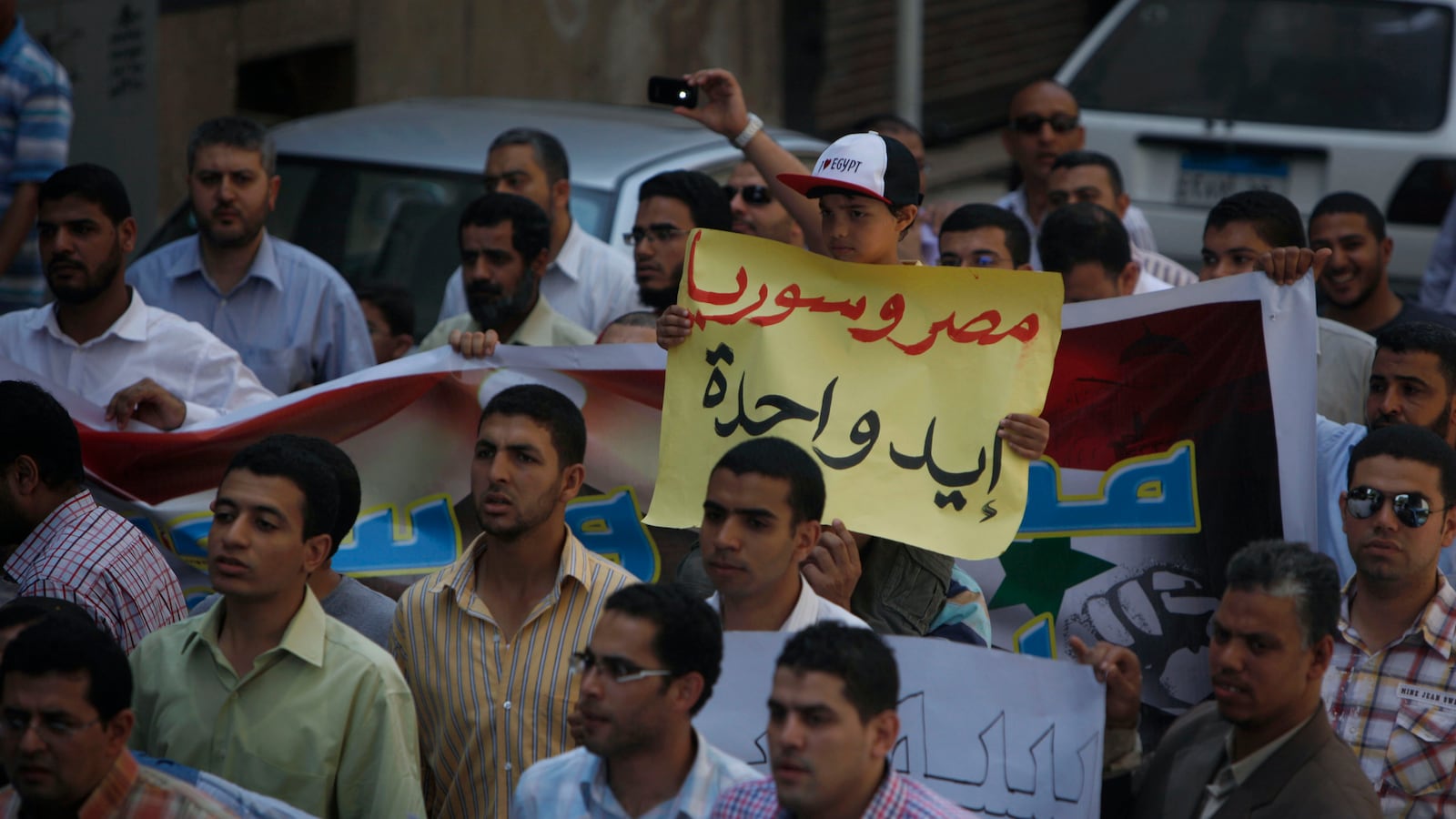 articles/2013/05/03/desperate-to-go-to-war-syrians-in-egypt-find-an-ally-to-help/130502-Syrians-Egypt-tease_vk3yvn