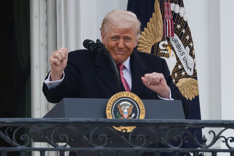 President Donald Trump dances after speaking from the Truman balcony during an event with farmers on the South Lawn of the White House on March 27, 2026 in Washington, DC.