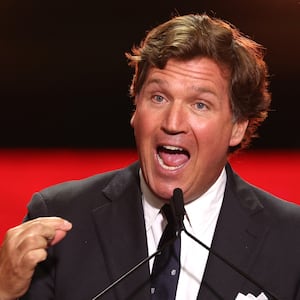 Tucker Carlson speaks during the public memorial service for right-wing activist Charlie Kirk at State Farm Stadium in Glendale, Arizona, on September 21, 2025.