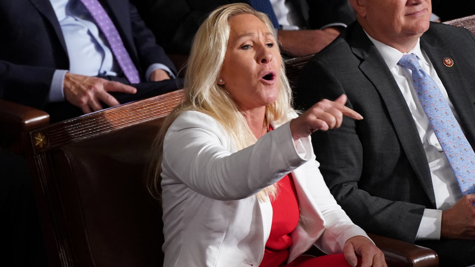 Rep. Marjorie Taylor Greene yells out at Hakeem Jeffries (D-NY) as Jeffries introduces newly elected Speaker of the House Mike Johnson (R-LA) after Johnson was elected to be the new speaker at the U.S. Capitol in Washington, D.C., Oct. 25, 2023.