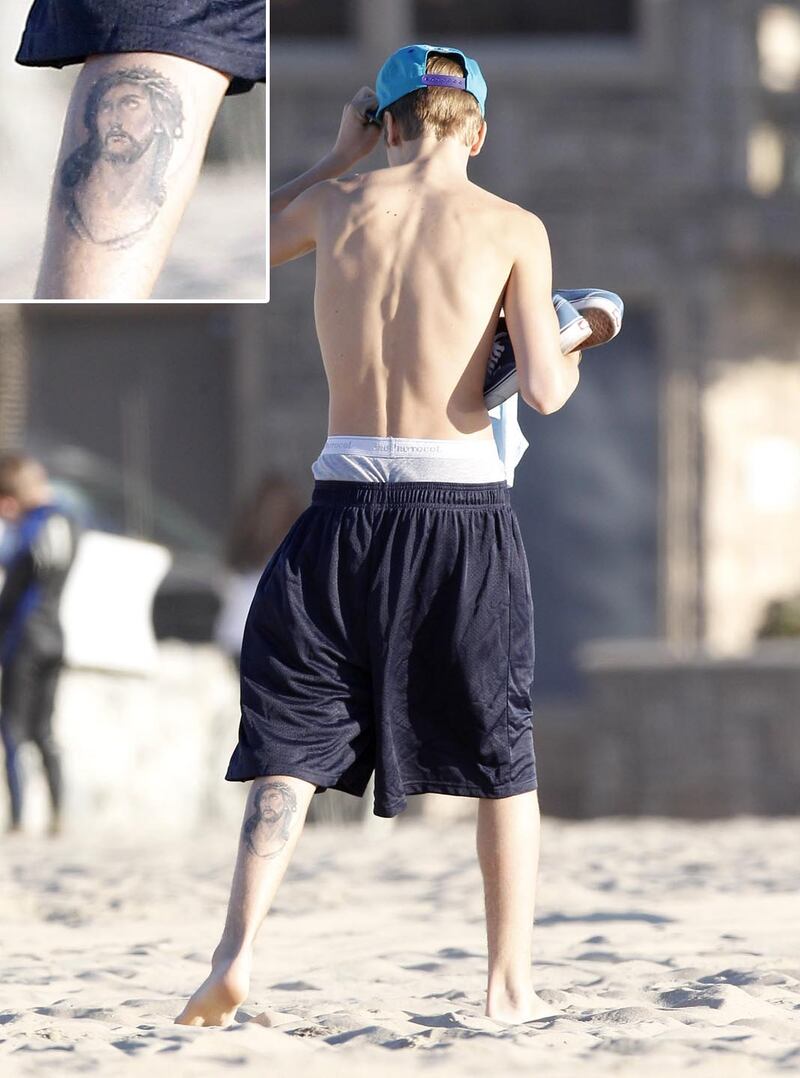 galleries/2013/05/02/justin-bieber-s-tattoos-a-selena-gomez-look-a-like-a-crown-jesus-ink-and-more/130429-justin-bieber-tattoos19_acvqg0