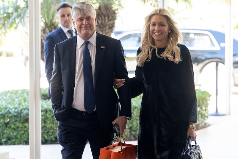 Fox News host Sean Hannity and his fiancée, Fox News host Ainsley Earhardt, arrive to attend the wedding of Dan Scavino, White House Deputy Chief of Staff, and Erin Elmore, the Department of State Director of Art in Embassies, at Mar-a-Lago in Palm Beach, Florida, February 1, 2026.