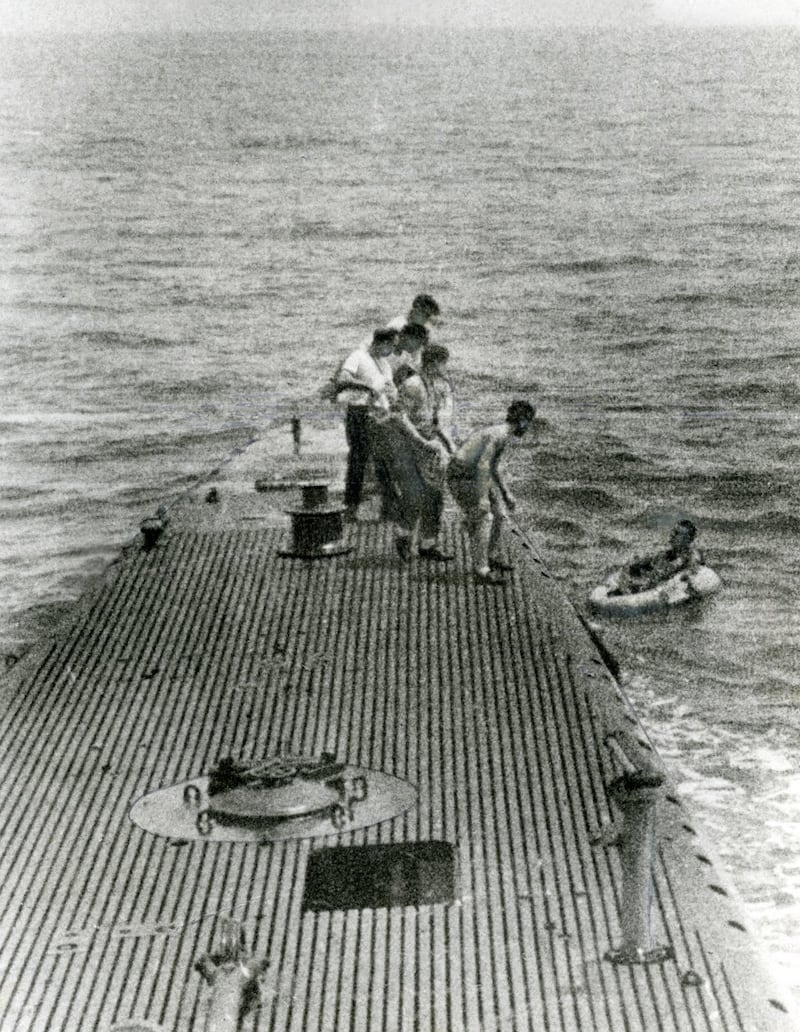The crew of the USS Finback pulls 20-year-old Lieutenant George H.W. Bush from the Pacific Ocean in a rubber raft after his bomber was shot down by Japanese anti-aircraft fire on Sept. 2, 1944.