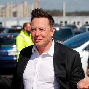 Tesla CEO Elon Musk gestures as he arrives to visit the construction site of the future US electric car giant Tesla, on September 03, 2020 in Gruenheide near Berlin. - Tesla builds a compound at the site in Gruenheide in Brandenburg for its first European "Gigafactory" near Berlin. (Photo by Odd ANDERSEN / AFP) (Photo by ODD ANDERSEN/AFP via Getty Images)