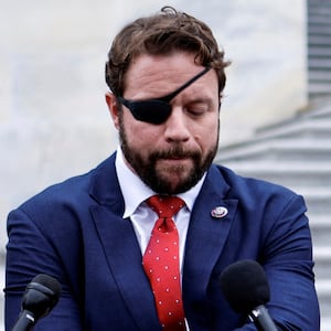 U.S. Representative Dan Crenshaw (R-TX) speaks with reporters as he departs after a series of failed votes on spending packages at the U.S. Capitol ahead of a looming government shutdown in Washington, U.S. September 29, 2023.  REUTERS/Jonathan Ernst     TPX IMAGES OF THE DAY