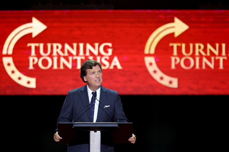 Political commentator Tucker Carlson speaks during a memorial service for slain conservative commentator Charlie Kirk at State Farm Stadium, Arizona, U.S., September 21, 2025.  REUTERS/Carlos Barria