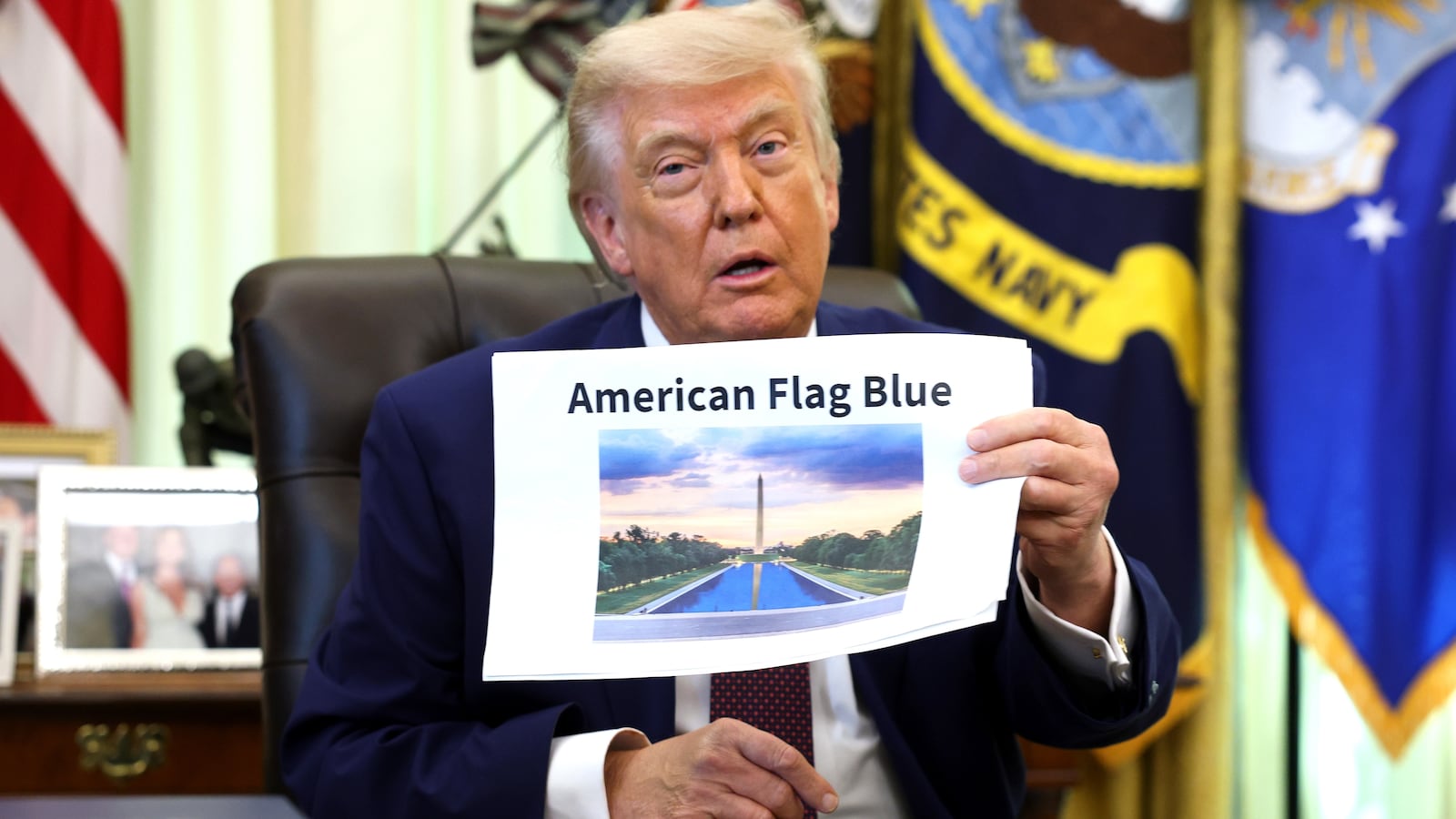 President Donald Trump displays a rendering of his proposed renovations to the Lincoln Memorial Reflecting Pool during an event in the Oval Office of the White House on June 03, 2026 in Washington, DC. The landmark is being painted as part of President Trump's efforts to repair Washington D.C. in preparation for the Nation's 250th birthday.