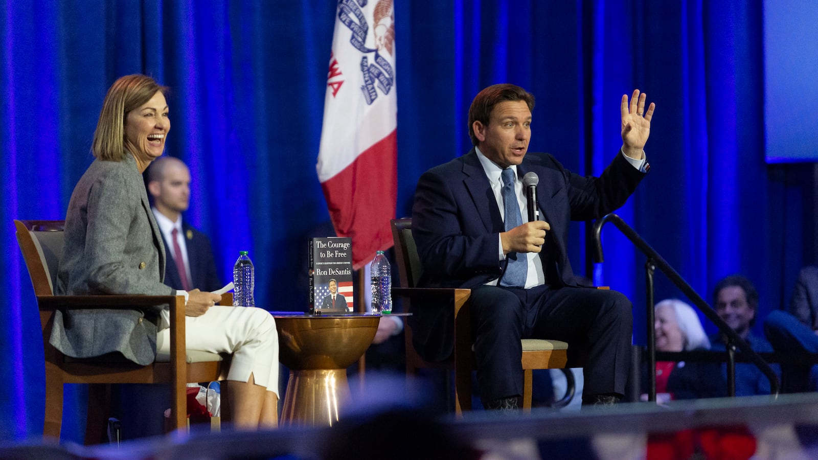 Iowa Gov. Kim Reynolds and Florida Gov. Ron DeSantis speak on a book tour in Des Moines on March 10, 2023.