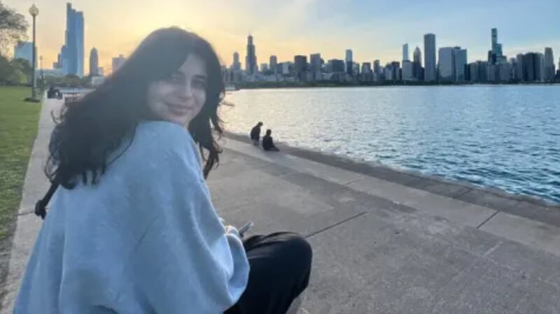 Katie Abraham sits by Lake Michigan in Chicago.