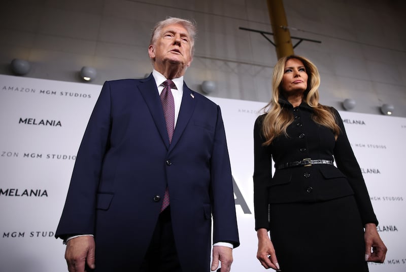 U.S. President Donald Trump and first lady Melania Trump speak to reporters as they attend a screening of the documentary film “Melania” at The Kennedy Center on January 29, 2026 in Washington, DC. “Melania” was directed by Brett Ratner, and Amazon paid $40 million to license the film, which follows the first lady in the twenty days before her return to the White House.