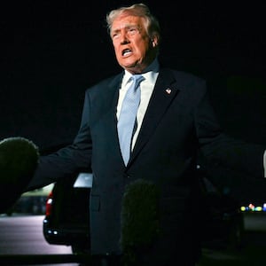 US President Donald Trump speaks with reporters before boarding Air Force One as he departs Palm Beach International Airport in West Palm Beach, Florida, on November 16, 2025. Trump is returning to the White House after spending the weekend at his Mar-a-Lago, Florida, residence. (Photo by Jim WATSON / AFP) (Photo by JIM WATSON/AFP via Getty Images)