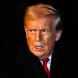 President Donald Trump walks over to reporters to make a brief statement before departing from the South Lawn of the White House in Marine One on January 20, 2026 in Washington, DC.