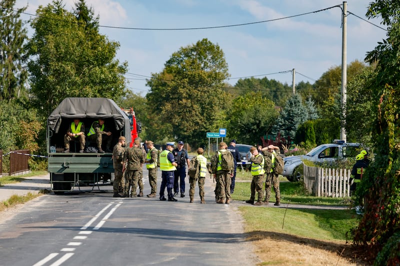 Police and army gather to inspect a house destroyed by debris from a shot down Russian drone in the village of Wyryki-Wola, eastern Poland, on September 10, 2025. NATO air defences helped counter drones that entered Polish airspace overnight and alliance chief Mark Rutte is in contact with Warsaw, a NATO spokeswoman said. Polish Prime Minister Donald Tusk said that a violation of Polish airspace by several Russian drones overnight was a major provocation aimed at the EU and NATO member. (Photo by Wojtek RADWANSKI / AFP) (Photo by WOJTEK RADWANSKI/AFP via Getty Images)
