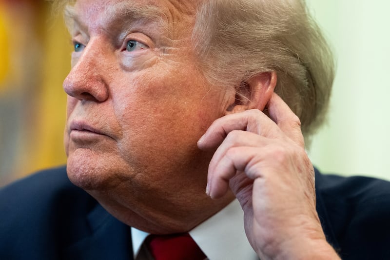U.S. President Donald Trump looks on after signing an executive order on vehicle repairs in the Oval Office at the White House in Washington, D.C., U.S., June 29, 2026.