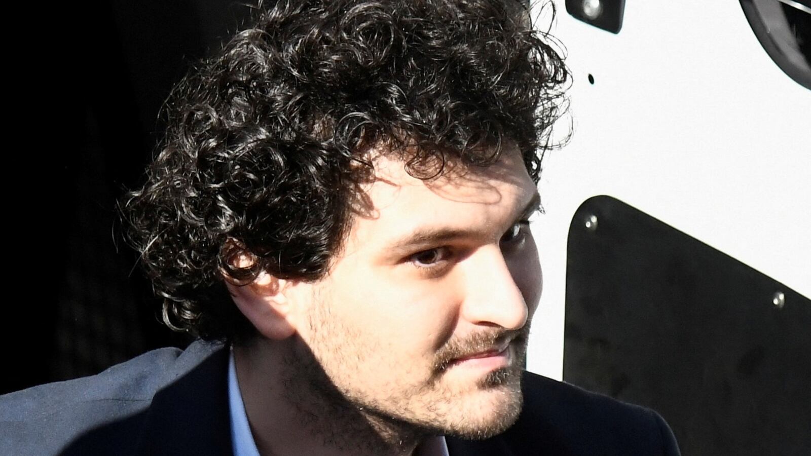 Sam Bankman-Fried, the founder and former CEO of crypto currency exchange FTX, is escorted into the Magistrate Court building in Nassau, Bahamas December 21, 2022.