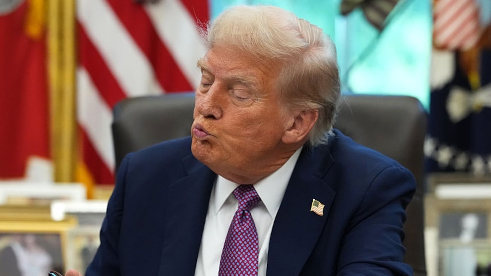 U.S. President Donald Trump signs executive orders during a press availability in the Oval Office of the White House on September 05, 2025 in Washington, DC. President Trump signed executive orders which included the renaming of the Department of Defense to the Department of War. (Photo by Kevin Dietsch/Getty Images)