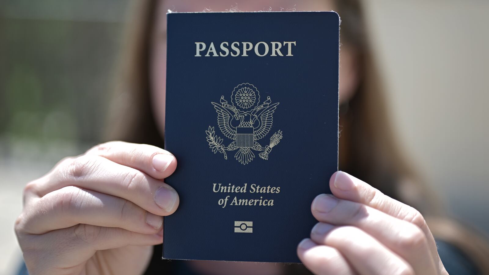 Danya Strait show her passport at her apartment in Denver, Colorado on Tuesday, May 27, 2025.