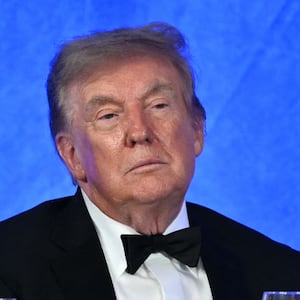 White House Press Secretary Karoline Leavitt and US President Donald Trump watch Oz 'Oz the Mentalist' Pearlman perform during the 2026 White House Correspondents' Association (WHCA) Dinner at the Waldorf Astoria in Washington, DC, on July 24, 2026. The 2026 WHCA Dinner was originally scheduled for April 25 at the Washington Hilton, but was rescheduled and relocated after an alleged gunman breached security. (Photo by Mandel NGAN / AFP via Getty Images)
