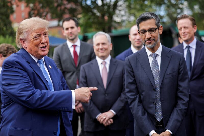 US President Donald Trump points at Google CEO Sundar Pichai as he speaks to the press at the White House driveway following a luncheon for tech leaders in the East Room, in Washington, D.C., US, September 29, 2026. REUTERS/Jonathan Ernst