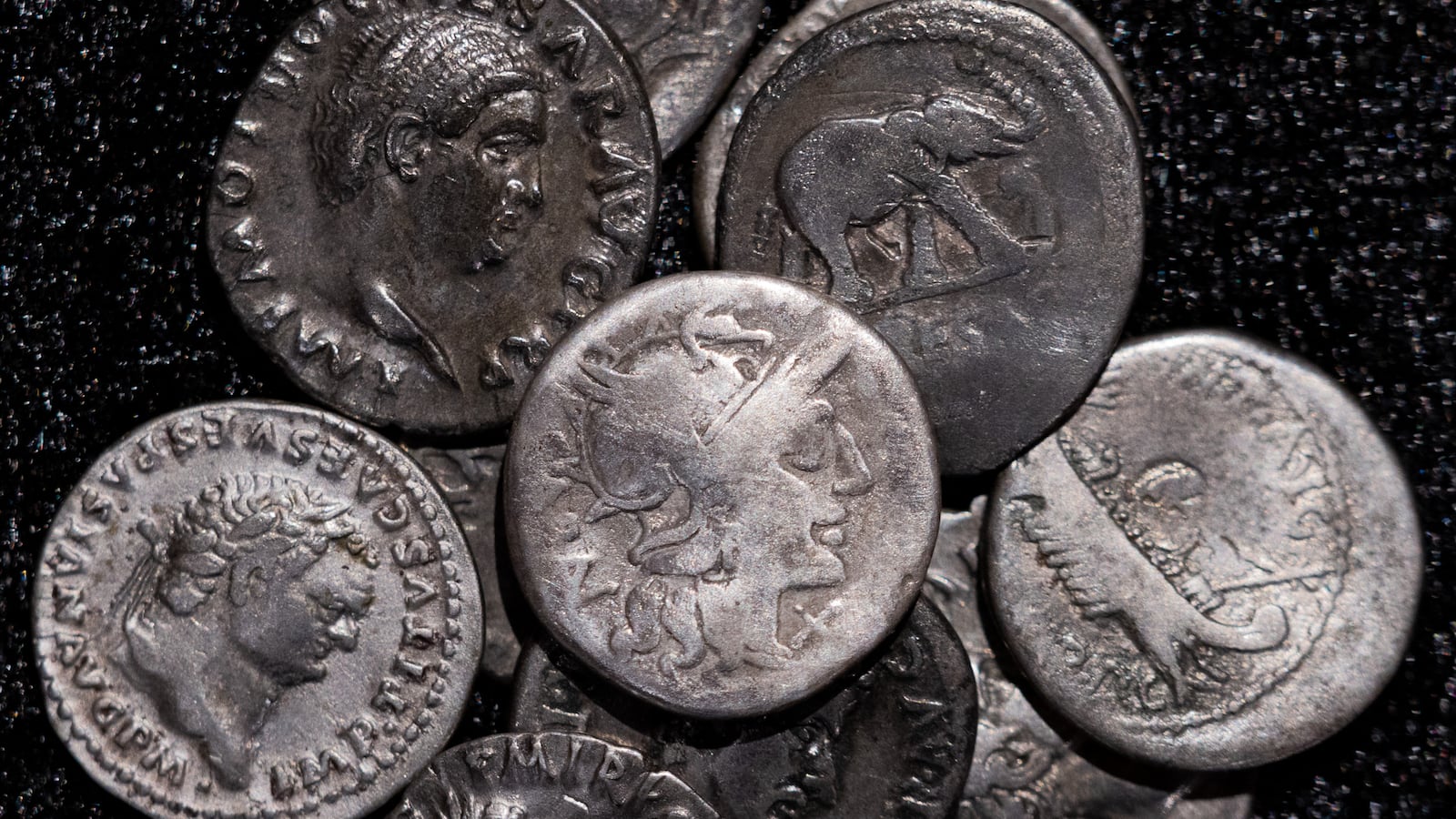 22 September 2026, North Rhine-Westphalia, Bonn: Roman coins, including the oldest coin (M) dating from 148 B.C., when Rome was still a republic without an emperor, are on display at the LVR State Museum. On an ordinary field near Wesseling, south of Cologne, Riedl, a family man, discovered a treasure from Roman times. He was using a metal detector there when he suddenly came across one silver coin after another. Photo: Rolf Vennenbernd/dpa (Photo by Rolf Vennenbernd/picture alliance via Getty Images)