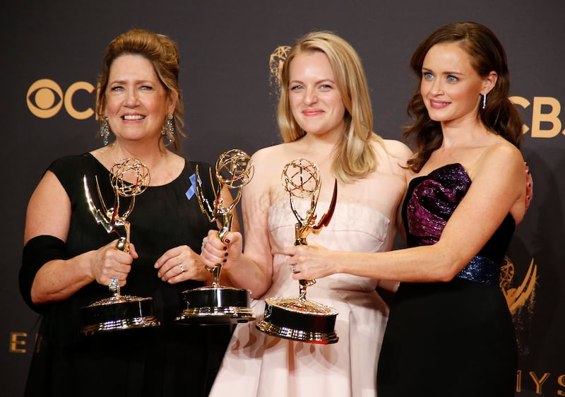 Ann Dowd (L) poses with the Emmy for Outstanding Supporting Actress in a Drama Series, Elisabeth Moss with the Emmy for Outstanding Lead Actress in a Drama Series and Alexis Bledel with the Emmy for Outstanding Guest Actress in a Drama, all awards for the The Handmaid's Tale