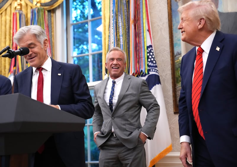 WASHINGTON, DC - OCTOBER 10: U.S. President Donald Trump (R) Health and Human Services Secretary Robert F. Kennedy Jr. (C), and Centers for Medicare & Medicaid Services Mehmet Oz smile in the Oval Office of the White House on October 10, 2025 in Washington, DC. Trump is announcing a deal with pharmaceutical company AstraZeneca to lower U.S. prescription drug prices. (Photo by Andrew Harnik/Getty Images)