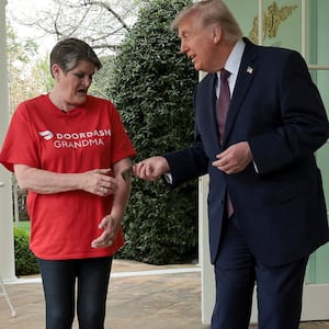 U.S. President Donald Trump pays Sharon Simmons after receiving a McDonald's order via DoorDash.