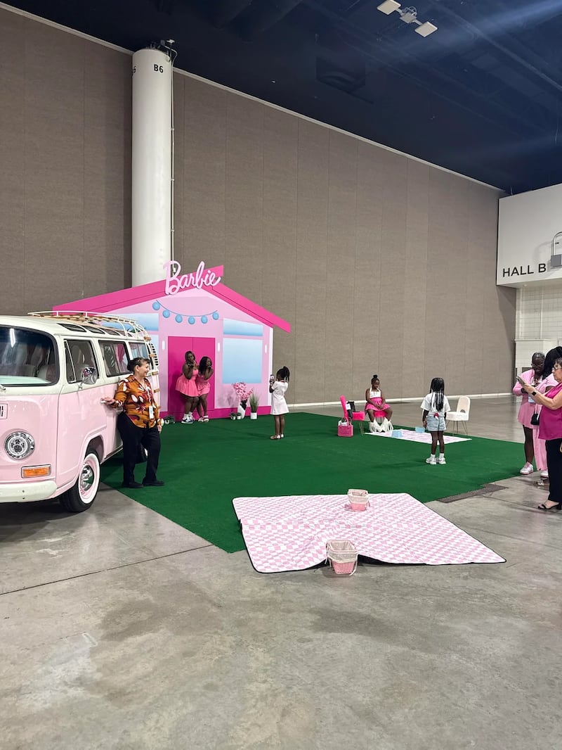 Attendees arrived at a cavernous convention hall filled with less-than-impressive Barbie-themed props.