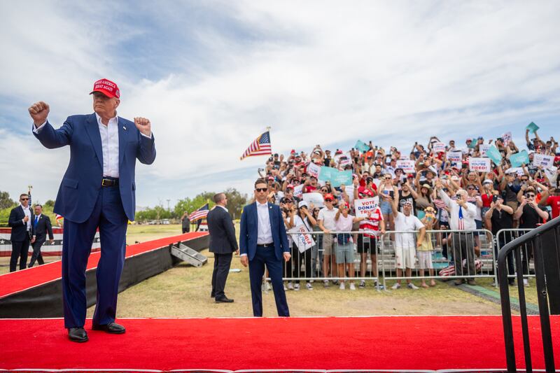 Republican presidential candidate Donald Trump dances upon arrival at his campaign rally at Sunset Park on June 9, 2024 in Las Vegas, Nevada.
