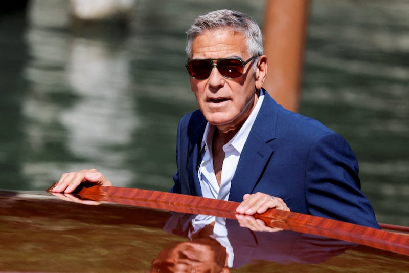 George Clooney arrives by boat at Palazzo del Casino, on the day of the opening ceremony of the 83rd Venice International Film Festival, in Venice, Italy