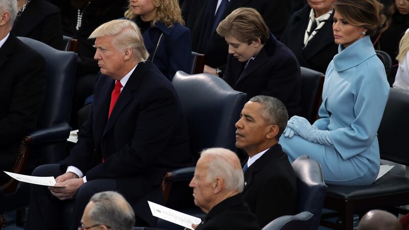 Barron Trump sits behind his dad and near Joe Biden at the inauguration in January 2025.