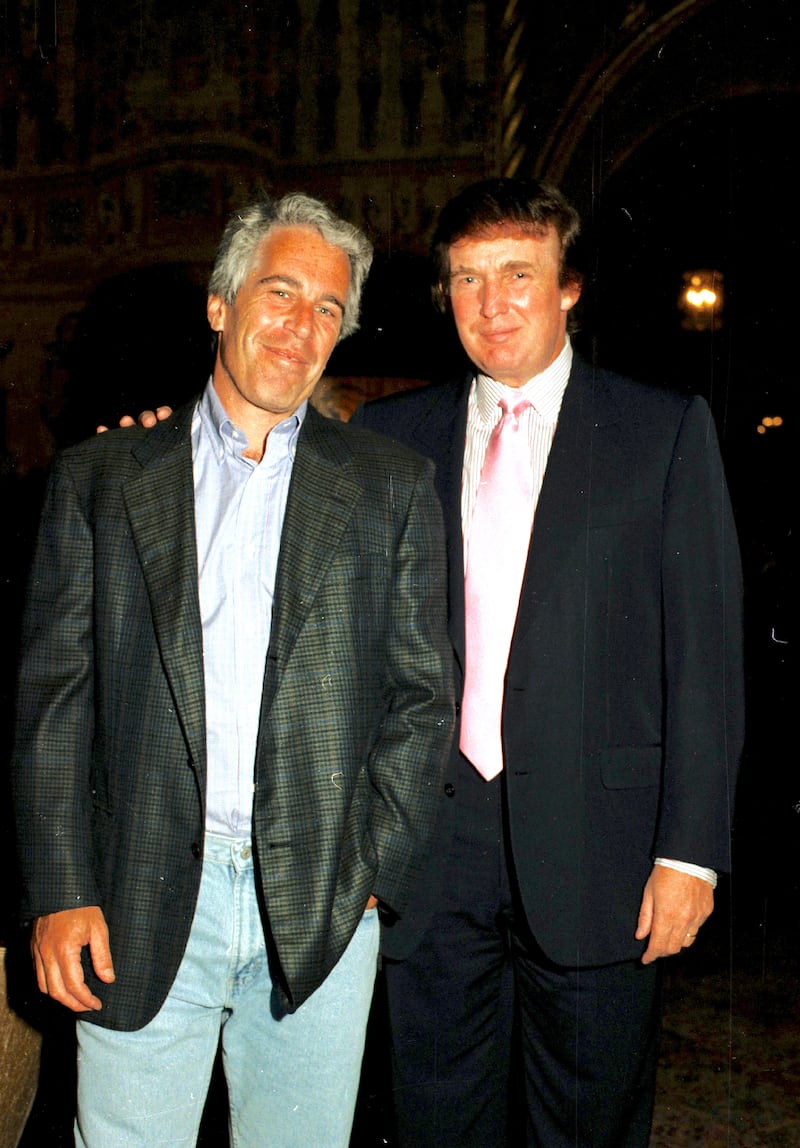 Jeffrey Epstein (left) and Donald Trump as they pose together at the Mar-a-Lago estate, Palm Beach, Florida on February 22, 1997.
