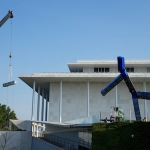 Crews work to remove the sculpture titled "Blue" by artist Joel Shapiro from the grounds of The Kennedy Center for the Performing Arts, after it was targeted for removal by the Trump administration, in Washington, D.C. on September, 2, 2026.