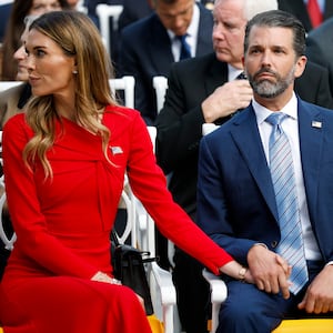 Donald Trump Jr. (R) sits with his girlfriend Bettina Anderson.