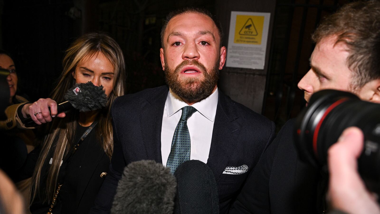 Conor McGregor leaves court in 2024.