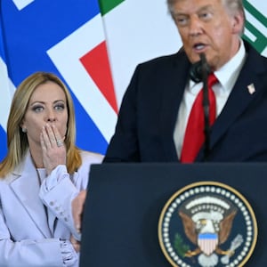 US President Donald Trump (C) speaks as Italian Prime Minister Giorgia Meloni (L) and Britain's Prime Minister Keir Starmer watch during the Sharm El-Sheikh Peace Summit in the Egyptian Red Sea resort town of Sharm el-Sheikh on October 13, 2025. Trump on October 13 hailed a Gaza summit in Egypt as a "tremendous day" for the Middle East, saying a document would be signed on "rules and regulations" for future talks. (Photo by SAUL LOEB / AFP) (Photo by SAUL LOEB/AFP via Getty Images)