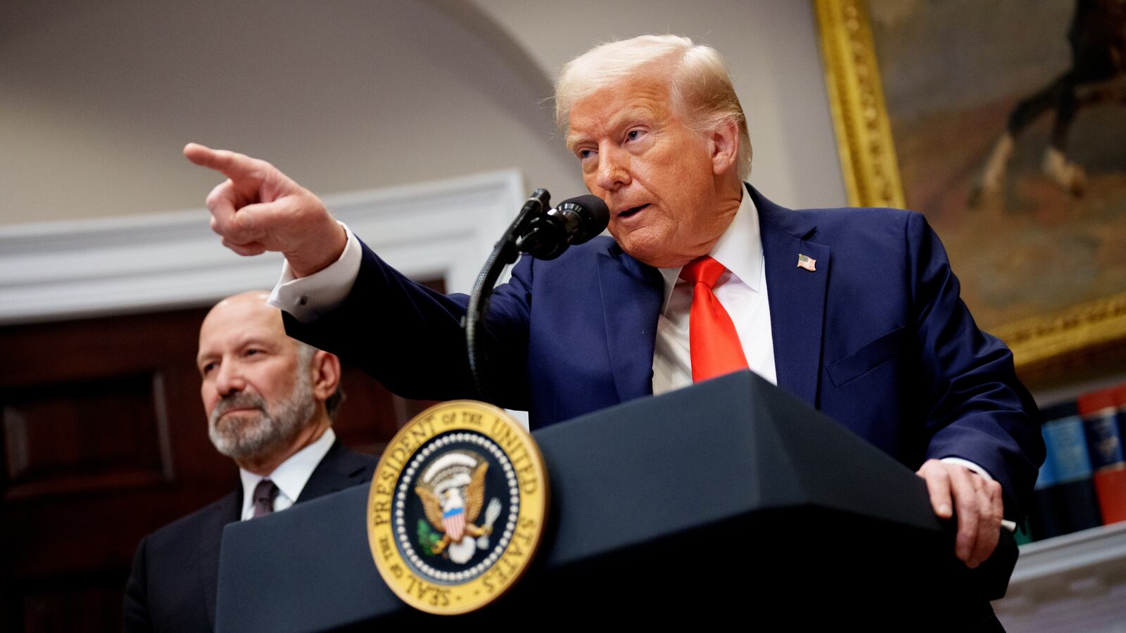 U.S. President Donald Trump takes a question from a reporter.