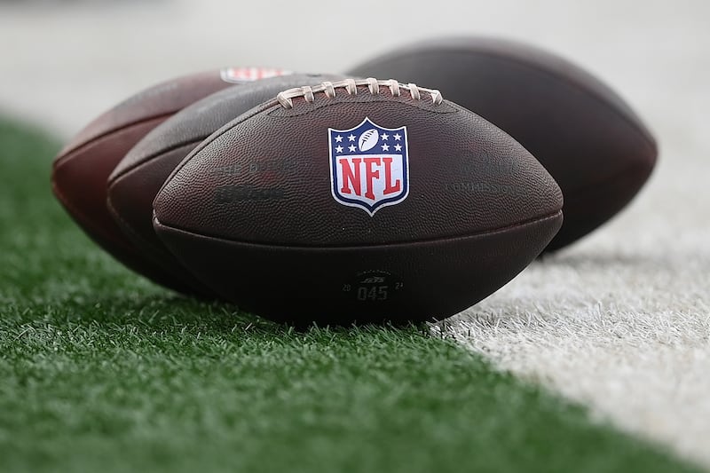 General view of the National Football League logo on footballs prior to the game between the New York Jets and the New York Giants at MetLife Stadium, on August 16, 2025, in East Rutherford, New Jersey.